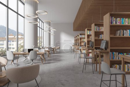 Photo for Modern library interior with table and chairs in row, bookshelf with pc computer on grey concrete floor. Stylish learning workplace in public loft with modern furniture. 3D rendering - Royalty Free Image