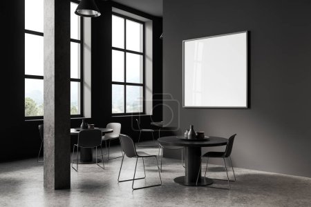 Téléchargez les photos : Intérieur de la cafétéria élégante avec des murs gris, sol en béton, table ronde confortable avec des chaises grises et affiche maquette carrée suspendue au-dessus. Rendu 3d - en image libre de droit