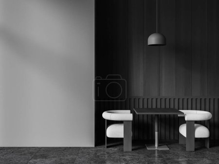 Foto de Interior del moderno restaurante con suelo de baldosas negras, paredes de madera gris y oscura, cómoda mesa cuadrada con dos sillones blancos y espacio de copia pared gris a la izquierda. renderizado 3d - Imagen libre de derechos