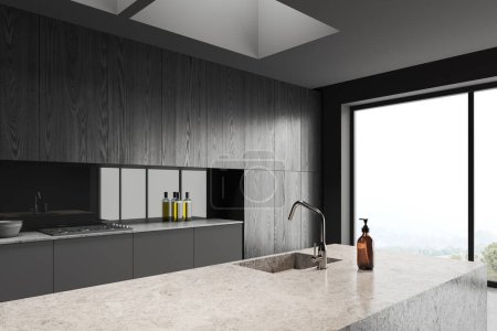 Téléchargez les photos : Dark home cuisine intérieure avec îlot de bar en béton, vue latérale. Coin cuisine avec étagères en bois noir caché et ustensiles de cuisine. Fenêtre panoramique sur campagne. rendu 3D - en image libre de droit