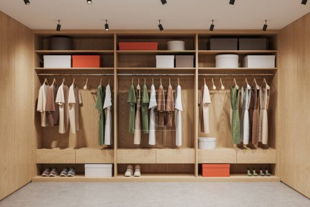 Photo for Interior of modern walk in closet with light wooden wardrobe with clothes hanging on rails, footwear and boxes standing on shelves. Organized wardrobe and fashion. 3d rendering - Royalty Free Image