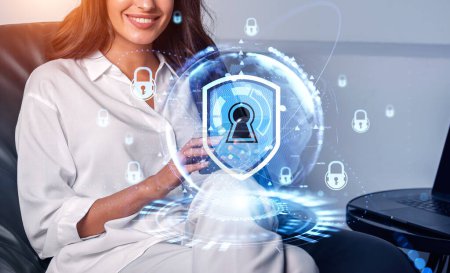 Photo for Businesswoman wearing formal wear sitting holding smartphone with digital interface with hologram of padlocks and keyhole. Office in background. Concept of information protection, privacy and security - Royalty Free Image