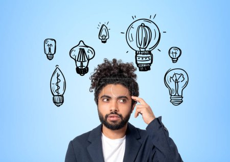 Photo for Thoughtful middle eastern businessman with finger on temple, different light bulb doodle on blue background. Concept of plan and brainstorm - Royalty Free Image