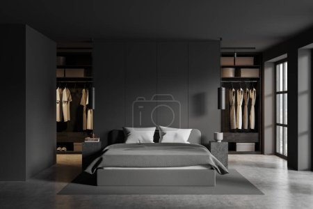 Foto de Dormitorio oscuro cama interior y estantes con ropa, armario minimalista en apartamento con ventana panorámica. Espacio para dormir oscuro con diseño moderno. Renderizado 3D - Imagen libre de derechos