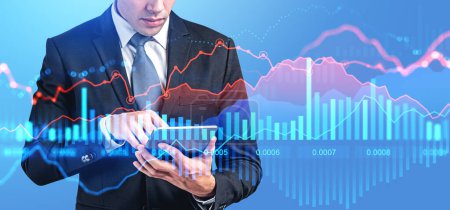 Photo for Businessman finger touch tablet, virtual screen with stock market lines and graph dynamics. Concept of online trading, forex analysis and money investment - Royalty Free Image