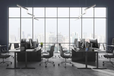 Photo for Dark coworking interior with armchairs and pc monitors in row, grey concrete floor. Corporate office workspace and panoramic window on Kuala Lumpur skyscrapers. 3D rendering - Royalty Free Image