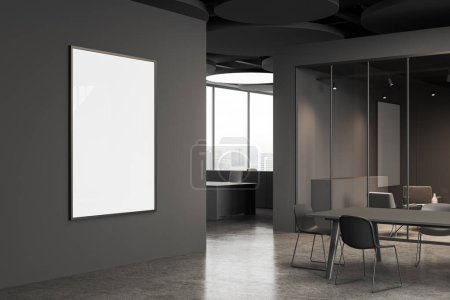 Photo for Dark office room interior with meeting board and chairs, side view lounge zone with armchairs behind glass doors. Panoramic window on skyscrapers. Mock up canvas poster on partition. 3D rendering - Royalty Free Image