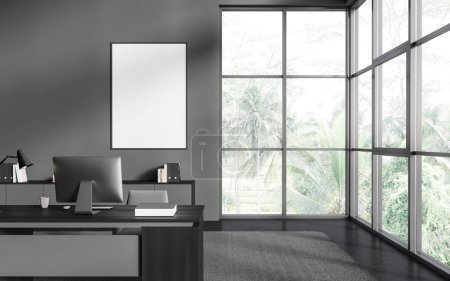 Photo for Interior of stylish CEO office with gray walls, concrete floor, panoramic window with tropical view, comfortable computer table and vertical mock up poster frame. 3d rendering - Royalty Free Image