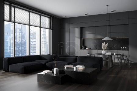 Photo for Dark studio interior with relax and dining area, side view sofa on hardwood floor. Dining table with chairs and kitchenware. Panoramic window on skyscrapers. 3D rendering - Royalty Free Image