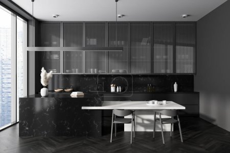 Photo for Dark kitchen interior with bar island, table and chairs on black hardwood floor. Kitchenware and minimal decoration. Panoramic window on skyscrapers. 3D rendering - Royalty Free Image