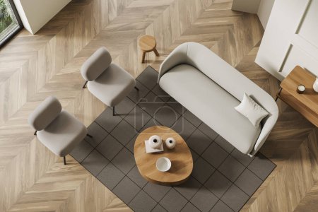 Téléchargez les photos : Vue du dessus du salon beige intérieur avec canapé et deux fauteuils, table basse et étagère avec une décoration minimale, tapis sur plancher de bois franc. rendu 3D - en image libre de droit