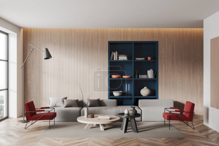 Foto de Casa moderna sala de estar interior con sofá, sillones rojos y mesa de centro, suelo de madera. Estante azul construido en pared de madera y ventana panorámica a la vista de la ciudad. Renderizado 3D - Imagen libre de derechos