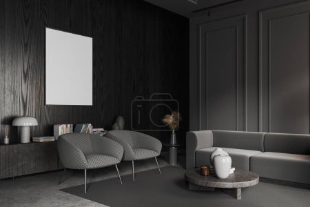 Corner of stylish living room with gray and dark wooden walls, round coffee table, cozy gray sofa and two armchairs with vertical mock up poster hanging above them. 3d rendering