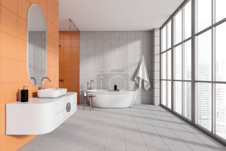 Photo for Orange and white bathroom interior with sink and dresser, bathtub and stool with accessories on tile floor. Panoramic window on skyscrapers view. 3D rendering - Royalty Free Image