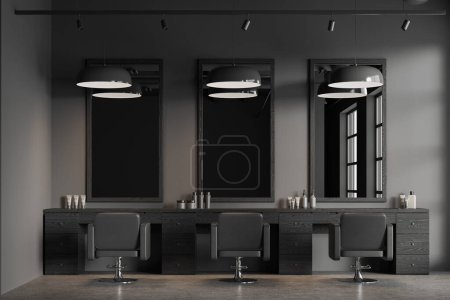 Téléchargez les photos : Intérieur du salon de coiffure contemporain en style loft avec murs gris, sol en béton, rangée de trois chaises de coiffeur et miroirs verticaux. Comptoir en bois foncé pour équipement de coiffure. Rendu 3d - en image libre de droit