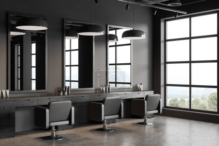 Photo for Dark stylish barber shop interior with dresser and armchairs in row, side view grey concrete floor. Minimalist accessories and lamps, panoramic window on countryside. 3D rendering - Royalty Free Image