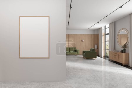 Foto de Interior de la moderna sala de estar con paredes blancas y de madera, suelo de mármol, acogedor sofá verde y sillón, vestidor de madera con espejo redondo por encima de ella y la maqueta vertical de póster. renderizado 3d - Imagen libre de derechos