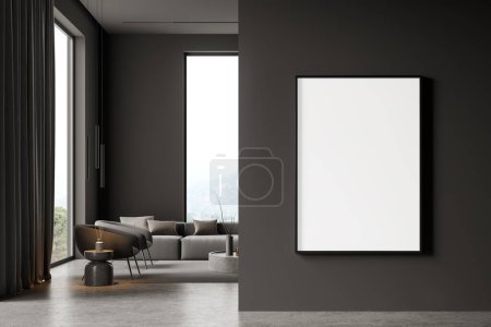 Foto de Interior de la sala de estar de casa oscura con sofá y mesa de centro, sillones en la alfombra y suelo de hormigón gris. Zona de salón con ventana panorámica. Simular cartel de lona en la partición. Renderizado 3D - Imagen libre de derechos