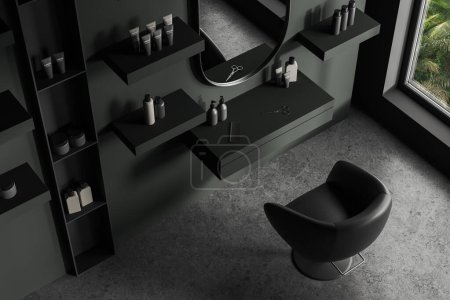 Photo for Top view of dark barber shop interior leather armchair and mirror, grey concrete floor. Mounted shelves with bottles and hairstyling tools, panoramic window on tropics. 3D rendering - Royalty Free Image