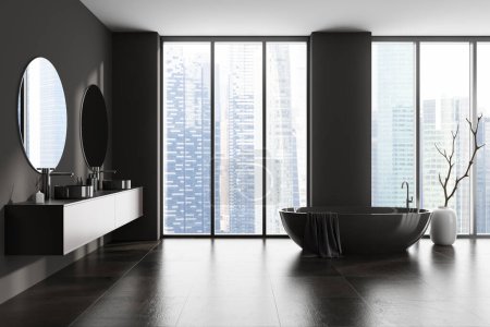 Photo for Side view on dark bathroom interior with bathtub, panoramic window with Singapore city skyscrapers view, double sink, two round mirrors, grey walls, vase, concrete tile floor, towel. 3d rendering - Royalty Free Image