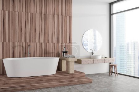 Photo for White hotel bathroom interior with bathtub on wooden podium, side view sink with minimalist bathing accessories. Panoramic window on skyscrapers. Copy space wooden wall. 3D rendering - Royalty Free Image