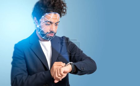 Photo for Serious middle eastern businessman with facial recognition by digital interface with line connection hologram watching time. Concept of modern technology of artificial intelligence biometric scanning - Royalty Free Image