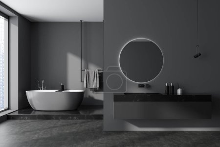 Photo for Dark bathroom interior with sink and accessories, bathtub on marble podium with towel rail. Panoramic window on skyscrapers, grey concrete floor. 3D rendering - Royalty Free Image