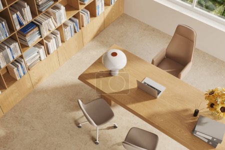 Photo for Top view of cozy ceo interior with laptop computer on wooden desk, bookshelf on beige concrete floor. Consulting space with minimalist decoration and window. 3D rendering - Royalty Free Image