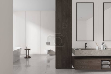 Photo for Interior of modern bathroom with white and wooden walls, tiled floor, cozy white bathtub, toilet and massive stone double sink with two vertical mirrors. 3d rendering - Royalty Free Image