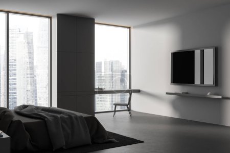 Foto de Interior del dormitorio oscuro con cama y pantalla de tv en la pared, escritorio con vista lateral con silla cerca de ventana panorámica en rascacielos. Rincón relajante con muebles minimalistas. Renderizado 3D - Imagen libre de derechos