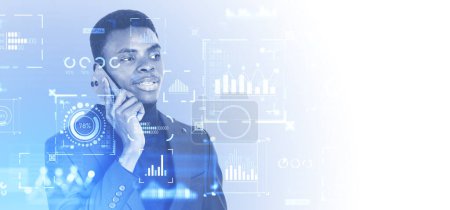 Photo for Portrait of serious young African American businessman talking on smartphone over blue background with double exposure of digital graphs and infographics. Business analytics concept, copy space - Royalty Free Image