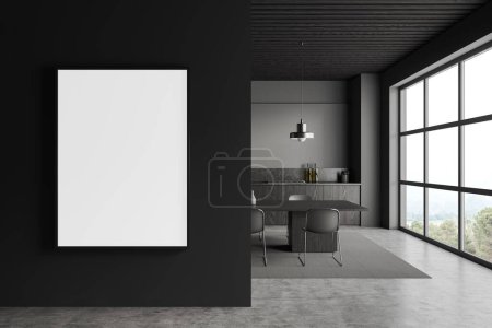 Photo for Dark home kitchen interior with eating table and chairs, carpet on grey concrete floor. Cooking zone with shelves and panoramic window. Mock up canvas poster on partition. 3D rendering - Royalty Free Image