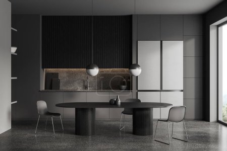 Photo for Grey home kitchen interior with oval eating table and chairs, grey concrete floor. Cooking area with cabinet shelves, fridge and kitchenware. Panoramic window on countryside. 3D rendering - Royalty Free Image