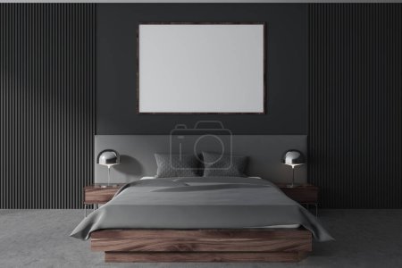 Foto de Dormitorio oscuro cama interior y ropa de cama gris, mesita de noche con lámpara de plata en el suelo de hormigón gris. Dormitorio con póster de lona en la pared gris. Renderizado 3D - Imagen libre de derechos