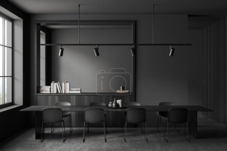 Photo for Dark living room interior with long dining table and chairs on grey concrete floor. Black wooden dresser with decoration and panoramic window. 3D rendering - Royalty Free Image