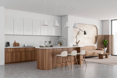 Photo for White studio flat interior with bar island and kitchenware, side view. Relaxing corner with sofa and coffee table on carpet. Panoramic window on skyscrapers. 3D rendering - Royalty Free Image