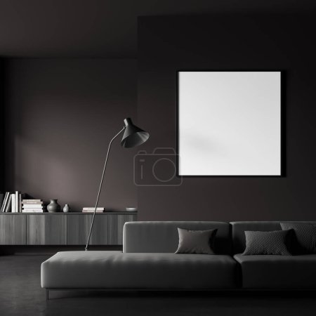 Photo for Dark living room interior with sofa and drawer with books, lamp on grey concrete floor. Relaxing area with soft place and decoration. Mockup square canvas poster. 3D rendering - Royalty Free Image