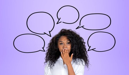 Photo for Black businesswoman portrait covering her mouth, surprised and astonished look, copy space thought bubbles on purple background. Concept of career and opportunities - Royalty Free Image