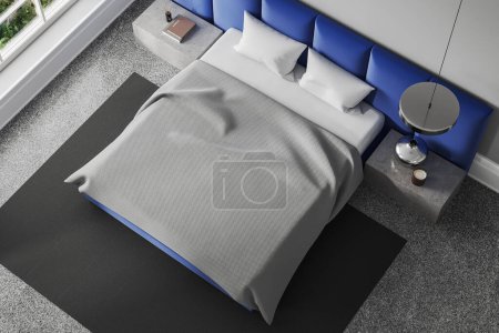 Photo for Top view of modern hotel bedroom interior with bed and accent wall, stone nightstand with books and decoration. Sleep corner with window on tropics. 3D rendering - Royalty Free Image