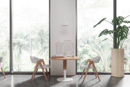 Foto de Interior del restaurante blanco con sillas blancas y mesa de madera, suelo de hormigón gris. Elegante espacio para comer cafetería con planta y ventana panorámica en los trópicos. Renderizado 3D - Imagen libre de derechos