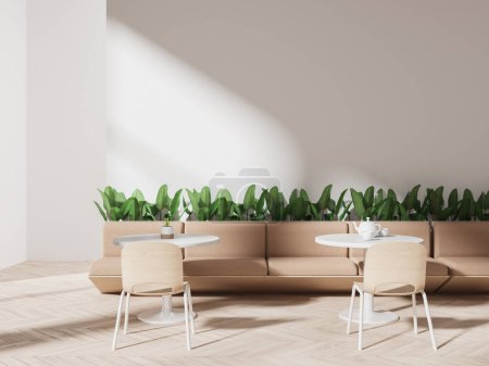 Téléchargez les photos : Intérieur de la cafétéria moderne avec des murs blancs, sol en bois, confortables canapés beiges debout près des tables rondes avec des chaises et des parterres de fleurs avec mur vierge au-dessus d'eux. Rendu 3d - en image libre de droit
