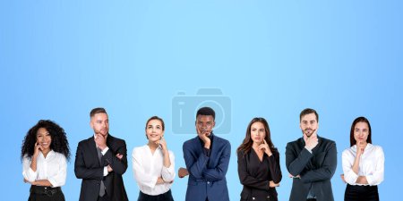 Photo for Group portrait of seven pensive diverse business people thinking standing in row over blue background. Concept of brainstorming and teamwork - Royalty Free Image