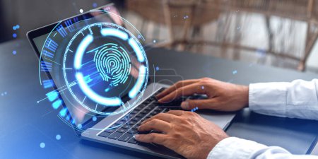 Photo for Hands of businessman using laptop at blurry office table with double exposure of futuristic HUD fingerprint interface. Concept of cyber security, data protection, biometric scanning and authentication - Royalty Free Image