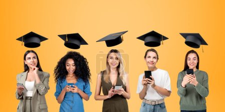Photo for Five business woman with smartphone, portraits in row with graduation hat on orange background. Students using gadget for online communication. Concept of e-learning, education and teamwork - Royalty Free Image