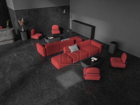 Téléchargez les photos : Vue de dessus de l'intérieur de réception sombre avec fauteuils rouges et canapé avec table basse, lieu de détente avec des meubles minimalistes. Coin d'attente et de réunion dans le bureau ou le hall d'entrée de l'hôtel. rendu 3D - en image libre de droit