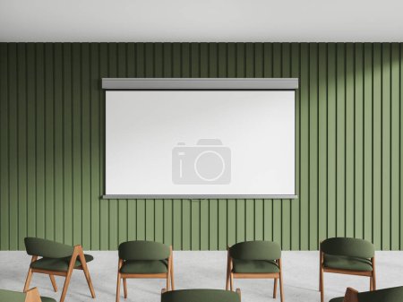Téléchargez les photos : Intérieur de classe moderne vert avec fauteuils en rangée, écran de projection d'espace de copie maquette sur le mur vert. Vue de face de l'espace d'entraînement ou de réunion avec un design élégant. rendu 3D - en image libre de droit