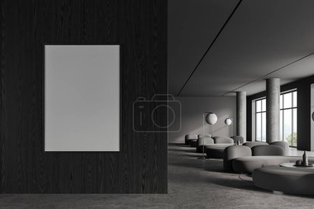 Photo for Modern business lounge zone interior with grey sofa and coffee table in row, grey concrete floor. Columns and panoramic window on countryside. Mock up canvas poster on partition. 3D rendering - Royalty Free Image