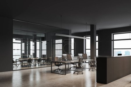 Photo for Dark business loft interior with coworking and glass meeting room, side view pc monitors on table and drawer partition. Panoramic window on skyscrapers. 3D rendering - Royalty Free Image
