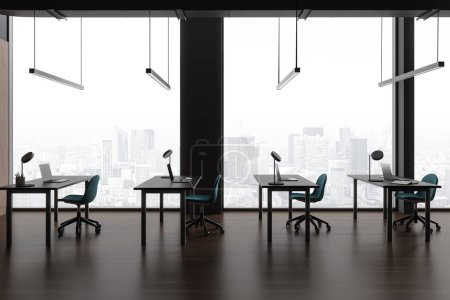 Foto de Interior moderno espacio de trabajo con sillones y mesa en fila, suelo de madera oscura. Sala de clase Business o biblioteca con ordenador portátil, ventana panorámica de los rascacielos de París. Renderizado 3D - Imagen libre de derechos