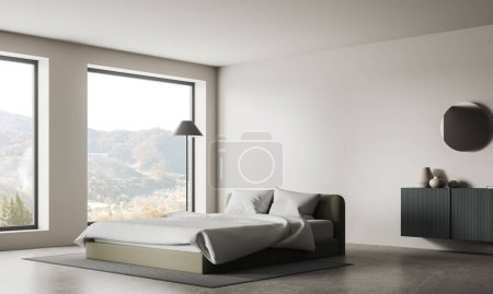Téléchargez les photos : Coin de la chambre moderne avec murs blancs, sol en béton, lit king size confortable, élégante commode grise et grandes fenêtres avec vue sur la montagne. Rendu 3d - en image libre de droit